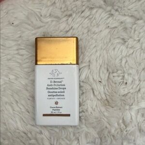 Drunk Elephant D-Bronzi Drops White and Gold Bottle